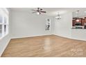 View of spacious living room with wood floors and neutral walls at 1828 Aston Mill Pl, Charlotte, NC 28273