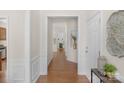 Inviting entryway with hardwood floors, decorative niche, and views of the living space at 2136 Ashley River Rd, Waxhaw, NC 28173