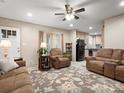 Inviting living room flows to the kitchen, features neutral tones, ceiling fan, and comfortable furniture at 2234 Emerald Mine Rd, Shelby, NC 28152