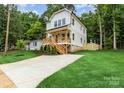 Beautiful new construction home featuring a spacious driveway and well-maintained lawn at 2512 Remington St, Charlotte, NC 28216