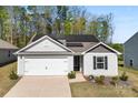 Attractive home with solar panels, well-manicured lawn and a convenient two-car garage at 3118 Maple Ridge Dr # 11, Gastonia, NC 28052