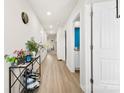 Bright hallway with light wood floors, leading to rooms with fresh, neutral paint at 3118 Maple Ridge Dr # 11, Gastonia, NC 28052