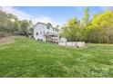 Backyard with above-ground pool, shed, large grassy area, and treed backdrop at 380 Hamrick Rd # 1, Gastonia, NC 28056