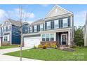 Charming two-story home with a well-maintained lawn, a two car garage and beautiful landscaping at 4024 Whipcord Dr, Waxhaw, NC 28173