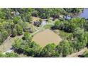 Expansive property with a large pond, surrounded by lush greenery at 4205 Cahnnas Way, Waxhaw, NC 28173