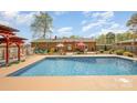 Large in-ground swimming pool with an expansive yard, perfect for outdoor activities at 424 Mirror Lake Rd, Salisbury, NC 28146
