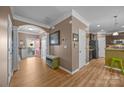 Spacious entryway featuring hardwood floors, an arched entryway, and access to the kitchen and outdoor area at 428 Winecoff Woods Nw Dr, Concord, NC 28027