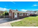 Charming brick single-story home with a well-maintained lawn and a bright blue sky overhead at 534 Georgia Ave, Statesville, NC 28677