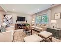 Cozy living room features neutral tones, plush seating, and lots of natural light at 700 Cooper Dr, Charlotte, NC 28210