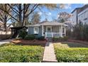 Charming bungalow with a welcoming front porch, brick path, and landscaped front yard at 106 N Turner Ave, Charlotte, NC 28216