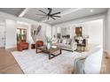 Cozy living room offering staircase views and an open floorplan with a modern kitchen at 111 Monbo Meadows Ln, Statesville, NC 28677