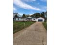 Spacious home with an attached garage, a long driveway, a well-maintained lawn, and charming curb appeal at 1110 Hollyberry Ln, Salisbury, NC 28147