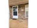 Charming front porch featuring a stylish front door, stone accents, and a welcoming entryway at 1110 Hollyberry Ln, Salisbury, NC 28147