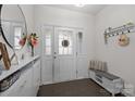 Bright entryway with decorative shelves, and front door, showcasing modern design at 1245 Pebble Grove Dr, Clover, SC 29710