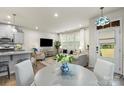 Open-concept living space with modern decor, hardwood floors, and ample natural light at 1354 Galloway Rd, Charlotte, NC 28262