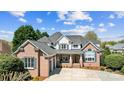 Beautiful two-story home showcasing a spacious driveway and manicured front yard at 1404 Churchill Downs Dr, Waxhaw, NC 28173