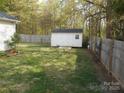 Backyard featuring a storage shed with double doors at 158 Margaret Turner Rd, Charlotte, NC 28216