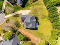 Birds-eye perspective of the property featuring a well-manicured lawn and elegant roof in a desirable neighborhood at 2004 Ptarmigan Ct, Waxhaw, NC 28173