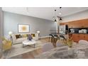 Open-concept living room with wood floors, island, and modern decor at 2094 Euclid Ave, Charlotte, NC 28203