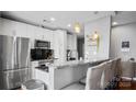 Modern kitchen with stainless steel appliances and granite countertops at 210 N Church St # 3507, Charlotte, NC 28202