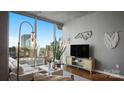 Stylish living room with floor-to-ceiling windows and sleek decor at 210 N Church St # 3507, Charlotte, NC 28202