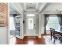 Bright foyer with decorative glass door, tray ceiling, and hardwood floors at 2808 Park Ridge Blvd, Rock Hill, SC 29732