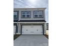 Beautiful two-car garage with modern trim and hardware at 4004 Crooked Spruce Ct, Matthews, NC 28105