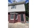 Close-up of the brick and siding exterior highlighting the front entrance of the property at 405 N Wilson St # 101, Rock Hill, SC 29730