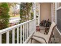 Cozy porch with a chair, offering a relaxing view of the quiet neighborhood street at 5127 Fernhill Dr, Charlotte, NC 28217