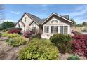 Beautiful home with stone and siding, arched windows, and lush, vibrant landscaping at 811 Wynnshire Dr # A, Hickory, NC 28601