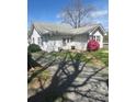 Charming home with a blooming azalea bush with mature tree and partial gravel driveway at 818 N 4Th St, Albemarle, NC 28001