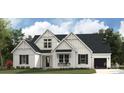 Charming two-story white farmhouse with black trim, a tidy lawn, and a window flower box at 8805 Wingard Dr, Waxhaw, NC 28173