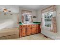 Retro kitchen featuring light cabinets, green counters, and bright natural light at 106 Courtland St, Chester, SC 29706