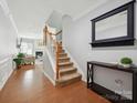 Entry way with hardwood floors and stairs leading to upper level at 15643 Canmore St, Charlotte, NC 28277