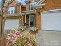 Beautiful brick home featuring a landscaped front yard and inviting entrance at 15643 Canmore St, Charlotte, NC 28277
