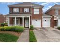 Charming brick home with a welcoming front porch and a two-car garage at 20015 N Cove Rd, Cornelius, NC 28031