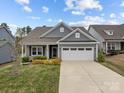 Charming single-Gathering home with a well-manicured lawn and inviting curb appeal, perfect for modern living at 224 Old Harbor Dr, Mount Gilead, NC 27306