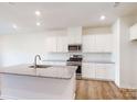 Modern kitchen featuring a granite island, stainless steel appliances, and recessed lighting at 2792 Yeager Nw Dr, Concord, NC 28027