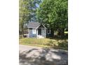 Charming single-story home with grey siding, white trim, and a well-maintained front yard at 401 Plymouth St, Kannapolis, NC 28083