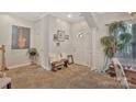 Inviting foyer featuring neutral walls, a bench with pillows, and a decorative plant at 4517 Sabin St, Rock Hill, SC 29732