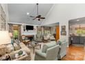 Bright living room features a fireplace, hardwood floors, and elegant furnishings with high ceilings at 481 Patriot Ne Ct, Concord, NC 28025