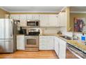 Bright kitchen with stainless steel appliances, granite countertops, and ample cabinet space at 9036 Four Mile Creek Rd, Charlotte, NC 28277
