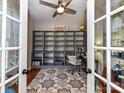 Bright home office with built-in bookshelves, desk, and ample natural light at 9427 Bethesda Ct, Matthews, NC 28104