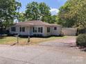 Traditional home with black shutters, tidy lawn, mailbox, and detached garage at 109 Barrett Rd, Cherryville, NC 28021
