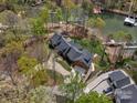 Expansive aerial view showcasing the home's lakeside location and sprawling grounds at 111 Milledge Dr, Mooresville, NC 28117