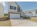 Charming two-story home with two-car garage, brick accents, and a well-maintained lawn at 1121 Red River Dr, Salisbury, NC 28144