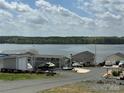 Picturesque waterfront homes along the lake, offering stunning views and convenient access to recreational activities at 171 Grand View Dr, New London, NC 28127