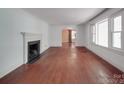 Bright living room with fireplace and hardwood floors, offering a cozy and inviting atmosphere at 2326 Armstrong Cir, Gastonia, NC 28054