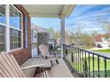 Relaxing front porch with wooden chairs, offering neighborhood views at 2425 Orofino Ct, Charlotte, NC 28269