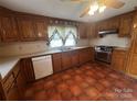 Traditional kitchen features wood cabinets, tile floor and stainless-steel appliances at 3253 Centergrove Rd, Kannapolis, NC 28083